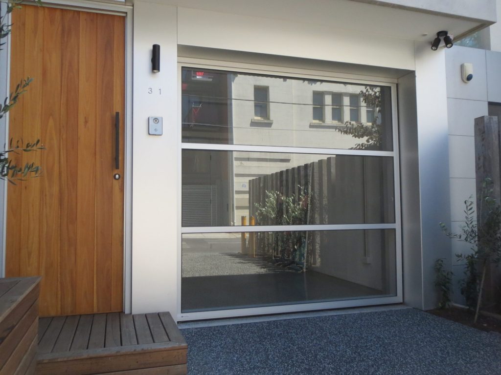 Home in Prahran featuring Glazed Tilt Garage Door