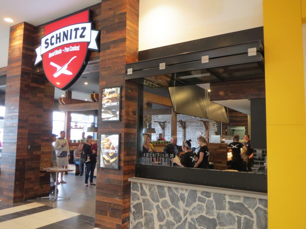 schnitz resturant with open folding windows during lunchtime service