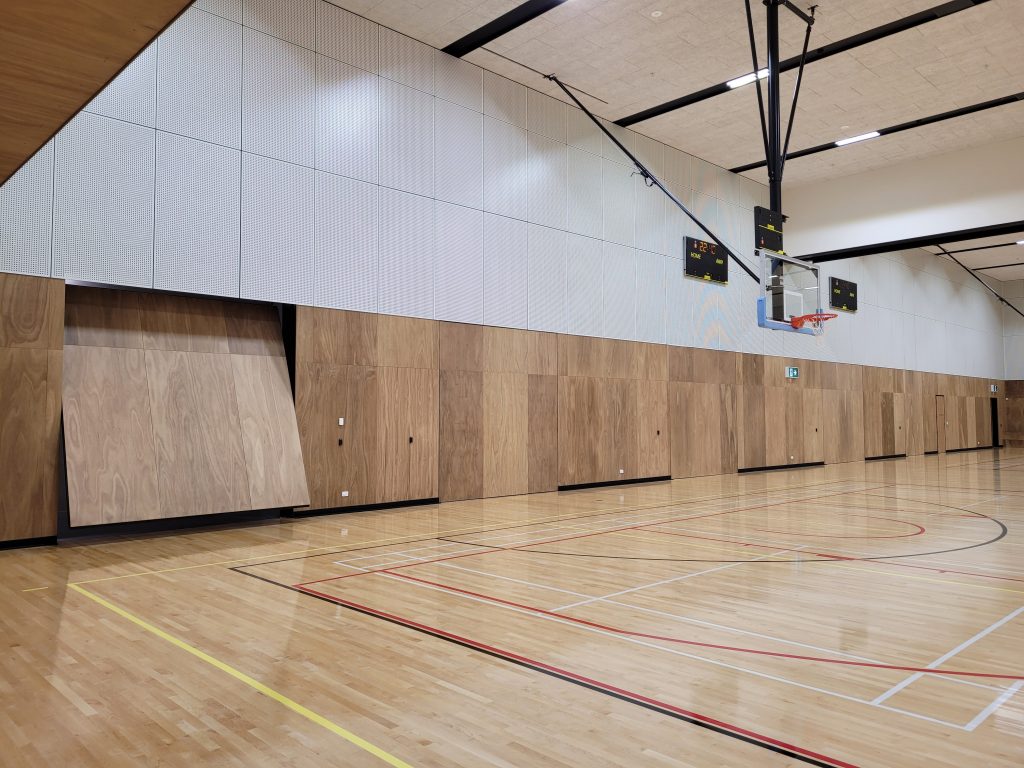 school gym, opening up their tilt doors to start the day