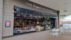 glazed folding window open above a well stocked bar