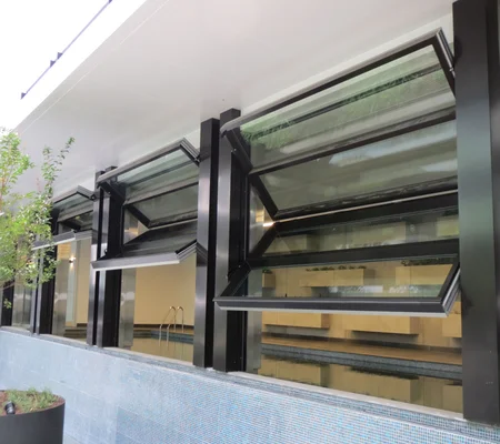 greensquare-apartments'-pool-room-is-the-perfect-spot-to-unwind-and-soak-in-the-pool,-with-its-spacious-layout-and-multiple-glazed-folding-doors-open-wide.